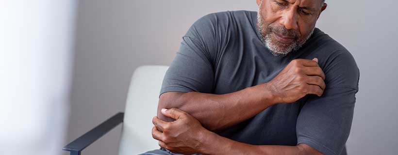 patient needing elbow pain treatment in Marlton